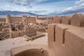 Panorama of narrow streets and walls of ancient persian city built from mud bricks. Rayen Citadel, Mahan, Iran, with Royalty Free Stock Photo