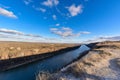 Panorama of nature in early spring. river in the sun, cloudy blue sky at sunset Royalty Free Stock Photo