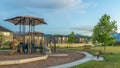 Panorama Neighborhood park with benches and pathway around a childrens playground