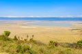 Panorama of Ngorongoro crater National Park with the Lake Magadi. Safari Tours in Savannah of Africa. Beautiful landscape scenery
