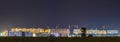 Panorama night view of many building cranes at construction site Royalty Free Stock Photo