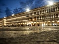 Panorama night view of Procuratie Vecchie Nuove classical arch architecture at Piazza San Marco in Venice Venezia Italy Royalty Free Stock Photo