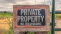 Panorama No Trespassing sign at a private property with old wire fence and metal gate Royalty Free Stock Photo