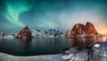 Panorama of Northern lights over mountain in hamnoy fishing village in winter Royalty Free Stock Photo