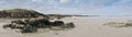 Panorama of ocean coast with rocks, cliffs and beach, dark gray sky, Donegal, Ireland Royalty Free Stock Photo