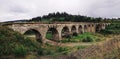 Panorama of the old austrian bridge through the river at the Karpatian mountains view from beginning Royalty Free Stock Photo