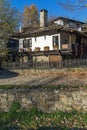 Panorama with Old house with wooden fence in village of Bozhentsi, Bulgaria