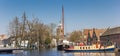 Panorama of old ships and church tower in Meppel