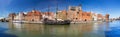 Panorama of the old town in Gdansk with historical port crane reflected in Motlawa river, Poland Royalty Free Stock Photo
