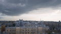 Panorama of old town with gray roofs in cloudy weather. Action. Historical and unremarkable center of city with old