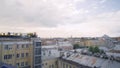 Panorama of old town with gray roofs in cloudy weather. Action. Historical and unremarkable center of city with old