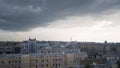 Panorama of old town with gray roofs in cloudy weather. Action. Historical and unremarkable center of city with old