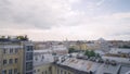 Panorama of old town with gray roofs in cloudy weather. Action. Historical and unremarkable center of city with old