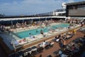 Panorama of the open deck with a luxurious pool and numerous tourists ship MSC Meraviglia, October 10, 2018