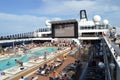 Panorama of the open deck with a luxurious pool and numerous tourists ship MSC Meraviglia, October 10, 2018