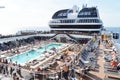 Panorama of the open deck with a luxurious pool and numerous tourists ship MSC Meraviglia, October 10, 2018