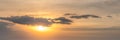 Panorama orange sunset sky with sun and cloud. Using as nature cover page
