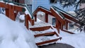 Panorama Oudoor stairs with grate metal treads and green handrails against a building