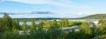 Panorama of Ounasjoki River and transparent corridor of Arktikum museum and science centre in Rovaniemi, Lapland, Finland