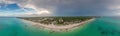 Panorama over a tropical beach taken from the water during the day Royalty Free Stock Photo