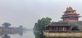 Panorama of Palace Museum at the Forbidden City and the surrounding water filled moat and heavy clouds in Beijing, China Royalty Free Stock Photo