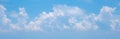 Panorama or panoramic photo of blue sky and white clouds or cloudscape. breathing concepts for billboard backdrop or background. Royalty Free Stock Photo