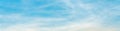 Panorama or panoramic photo of blue sky and white clouds or cloudscape. Royalty Free Stock Photo