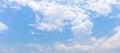 Panorama or panoramic photo of blue sky and white clouds or cloudscape. Royalty Free Stock Photo