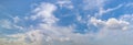 Panorama or panoramic photo of blue sky and white clouds or cloudscape. Royalty Free Stock Photo