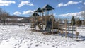 Panorama Park playground amid footprints on sunlit snow covering the ground in winter Royalty Free Stock Photo