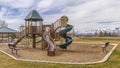 Panorama Park with playground and picnic pavilion overlooking a snow capped mountain