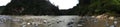 A panorama of the Pastaza river, a large ropical river running along two high cliffs