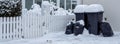 Panorama path in front of the garbage cans clear snow