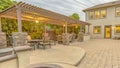 Panorama Patio with dining area and built in circular benches wrapped around a fire pit