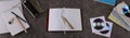 Panorama with pencils, notebooks and a notebook on a granite table background Royalty Free Stock Photo