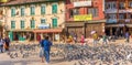 Panorama of people and pigeons at the Boudha Stupa in Kathmandu