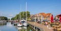 Panorama of people at a restaurant in the old harbor of Enkhuizen