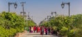 Panorama of people walking the path to the Mayadevi temple in Lumbini