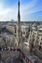 Panorama photo white marble statues Cathedral Duomo di Milano on piazza, cityscape. Royalty Free Stock Photo