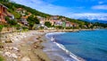 panorama of Pioppi with beach, blue sea and houses. Pioppi, Cilento, Campania, Italy Royalty Free Stock Photo