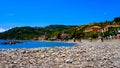 panorama of Pioppi with beach, blue sea and houses. Pioppi, Cilento, Campania, Italy Royalty Free Stock Photo