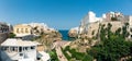 Panorama Polignano a mare coast in Bari, Italy during summer with turquoise blue water in the sea