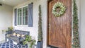 Panorama Porch of a house with wooden front door with digital key access