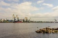 Panorama of the port cranes of ships. Railway cars on loading and unloading. le. Royalty Free Stock Photo