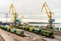 Panorama of the port cranes of ships. Railway cars on loading and unloading. le. Royalty Free Stock Photo