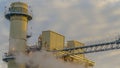 Panorama Power Plant in Utah Valley emitting smoke against sky filled with puffy clouds