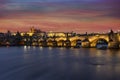panorama prague castle and charles bridge and st. vita church lights from street lights are reflected on the surface of the vltava Royalty Free Stock Photo