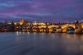 panorama prague castle and charles bridge and st. vita church lights from street lights are reflected on the surface of the vltava Royalty Free Stock Photo