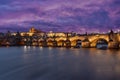 panorama prague castle and charles bridge and st. vita church lights from street lights are reflected on the surface of the vltava Royalty Free Stock Photo