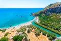 Panorama of Preveli beach at Libyan sea, river and palm forest, southern Crete. Royalty Free Stock Photo